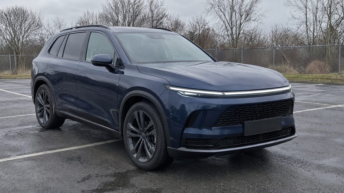 Before: a blue SUV on a car lot on an overcast day